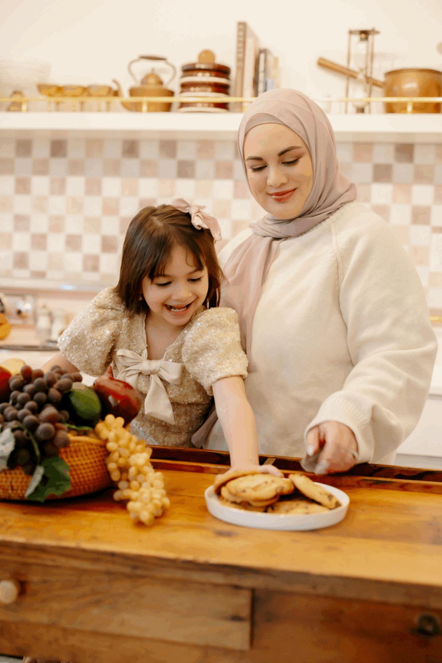 Café Zara’s owner and child at the bakery counter